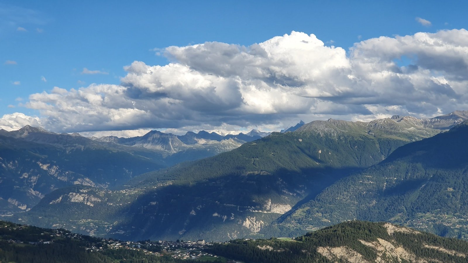 grass covered mountains during day